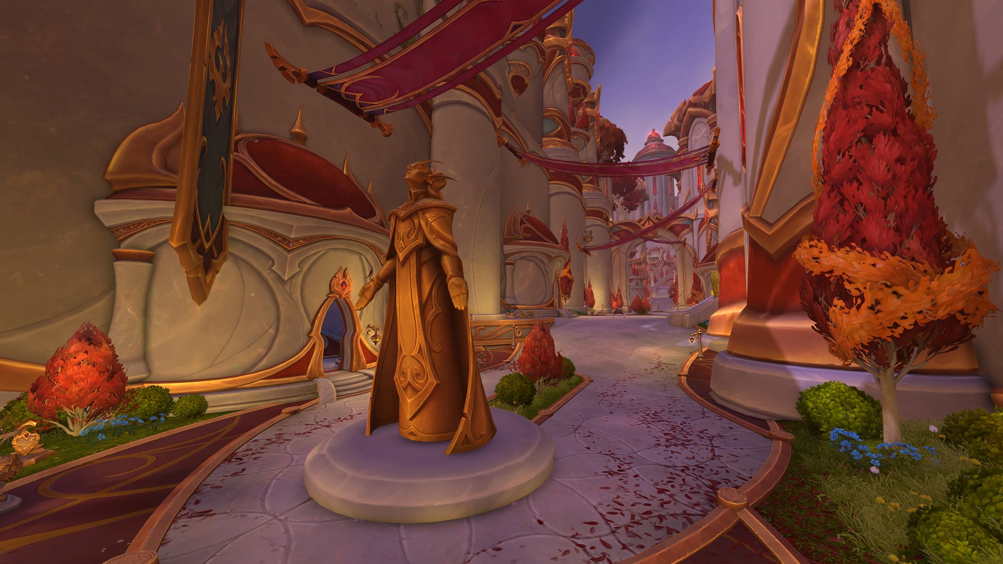 The streets of Silvermoon revamped for Midnight. The streets are white with golden accent and red roofs, banners, and trees.