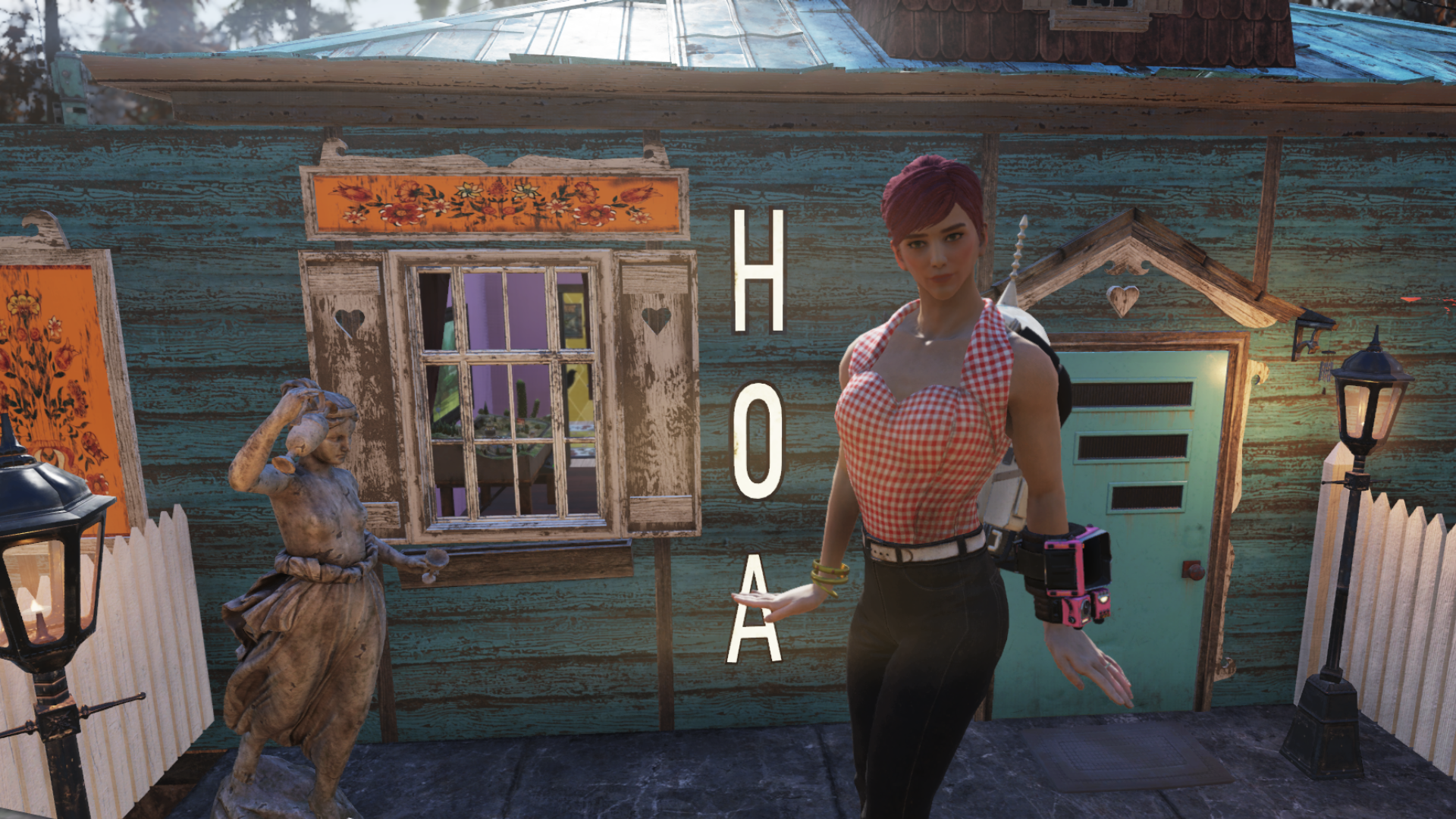 A screenshot from Fallout 76, showing a woman in a pink top and tight jeans, posing in front of a blue suburban house with big HOA letters next to the charming windows.