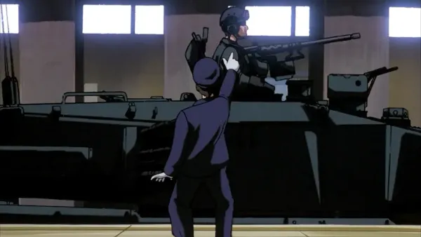 An image from the Patlabor anime, with a subway station attendant pointing at a tank driving through a subway station.